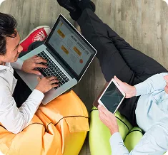 two-business-men-working-tablet-laptop (1)